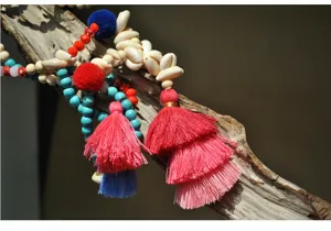 Bohemian handmade beaded necklace with colorful tassels, turquoise and natural seashells.