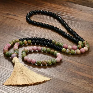 Detail close-up of natural stone 108 prayer beads necklace and matching bracelet with tassel.