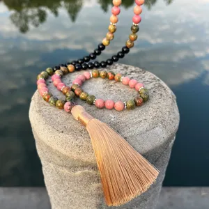 Long natural stone beaded tassel necklace with black and unakite stones jewelry detail view