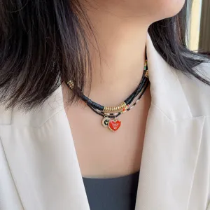 Mehrschichtige Perlen Kette mit rotem Herz Anhänger, stilvolle schwarze Gold Choker Frauen