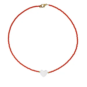 Red seed bead necklace with a white heart shell pendant, stylish aesthetic clavicle chain jewelry.