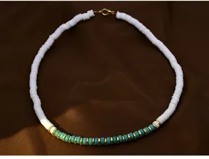 Detail view of a bohemian polymer clay bead necklace with colorful accents for styling.