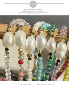 Close-up detail of colorful crystal and baroque pearl beaded layered necklace jewelry.