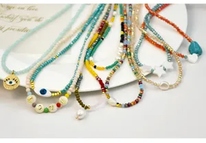 Colorful crystal beaded choker necklace set with pearls, evil eye charm and sweet love letters.