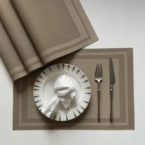 Woven PVC placemat set for dining table, brown heat-resistant non-slip table mat detail view.