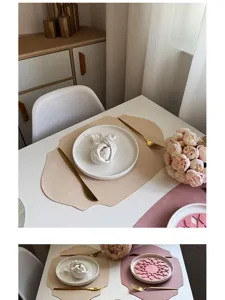 Detail of the elegant leather place mat, showing smooth texture and chic irregular shape.