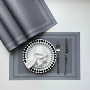 Grey PVC woven placemat heat insulation table mat set for dining room kitchen decor.