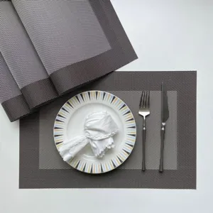 PVC woven placemat set for dining table, anti-slip heat-insulated table mats with cutlery and plate.