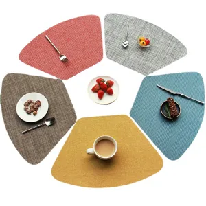 Fan-shaped woven placemat set, durable PVC heat-insulation table mat for home and kitchen dining decor.