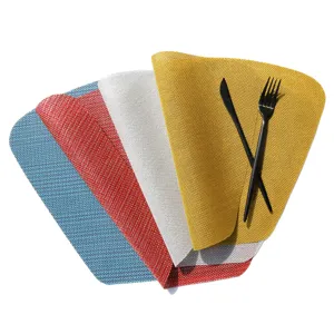 Colorful PVC woven placemats, fan-shaped heat-resistant table mats for home and hotel dining.
