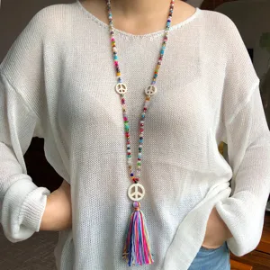 Long colorful beaded necklace with peace sign charms and tassel sweater chain for women.