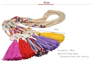 Lunga collana bohémien di perline di legno con nappe colorate e ciondoli turchesi 90cm