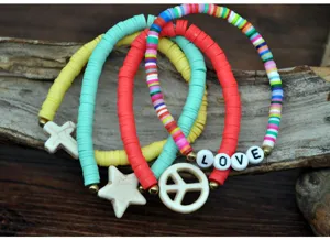 Colorful heishi clay bead bracelet detail featuring stylish star and love charms