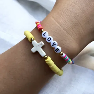 Colorful polymer clay bead bracelets set with cross pendant and love letter beads.