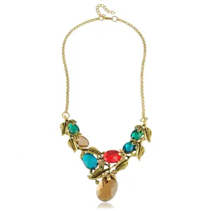 Vintage gold-tone statement choker necklace with colorful crystal stones and leaf charms for women.