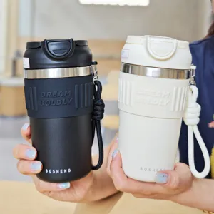 Stainless steel insulated coffee cup with silicone sleeve and portable lanyard for daily use.