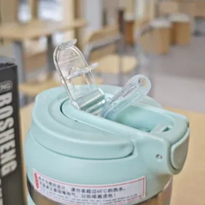 Detailed view of the vacuum straw cup lid, clear flip top and silicone mouthpiece design.