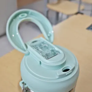 Stainless steel coffee mug lid detail view, portable insulated straw cup replacement part.