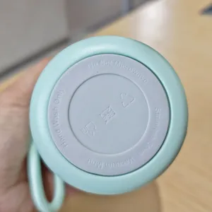 Stainless steel vacuum insulated coffee cup bottom detail view, portable daily drinkware.