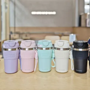 Stainless steel coffee cup with silicone sleeve, portable strap, dual drink lid, 5 colors.