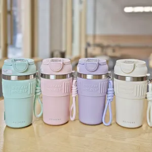 Stainless steel travel coffee mug with silicone sleeve and portable strap in four colors.