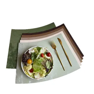 Elegant fan-shaped placemats set, waterproof leather table mats for dining room and hotel decor.
