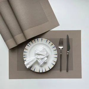 Premium PVC woven placemat set for modern dining tables, non-slip heat resistant mat.