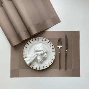 Premium PVC placemats set, woven heat-resistant table mats for dining room and hotel decor.