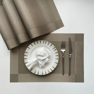 PVC woven placemat set for dining table, anti-slip heat insulation mat, elegant table decor.