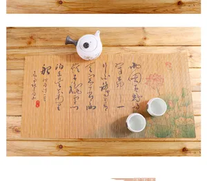Set di tappetini da tè in bambù zen cinese con teiera in ceramica per la cerimonia del tè.