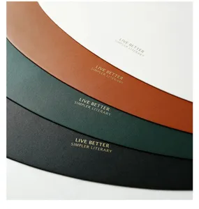 Close-up of stylish PU leather placemats in assorted colors, waterproof heat-resistant table mat.