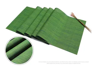 Primo piano della struttura del tessuto del runner da tavola verde, dettagli impermeabili.