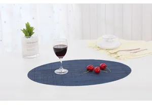 Oval blue PVC placemat with vertical stripes, heat-insulating table mat for dining room.