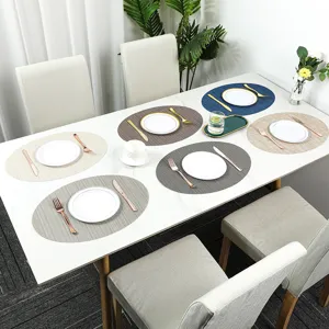 Oval PVC placemat for dining table, non-slip heat resistant western table mat with modern striped design.