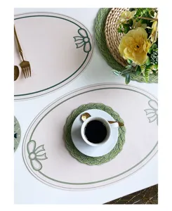 Exquisite leather table placemat with elegant bow print and waterproof surface detail view.