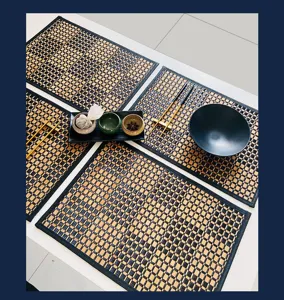 Detailed view of bamboo woven placemat on table with tea set, heat resistant tea mat.
