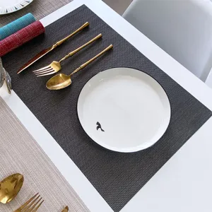 Dark grey PVC woven placemat, heat-resistant dining table mat for kitchen tableware decor.