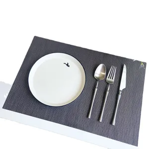 Durable Teslin woven placemat with heat insulation and anti-slip design for dining table decor.