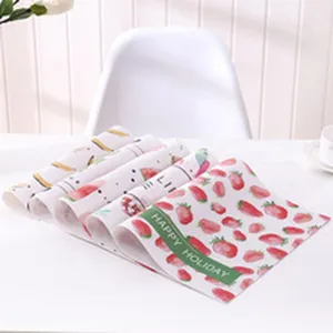 Detailed view of roll-up leather placemats with cute fruit prints, waterproof and heat insulated.