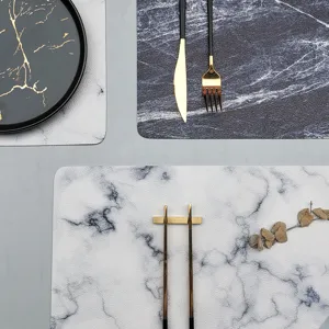 Marble texture leather placemat set top view presentation for dining table decor and tableware protection.