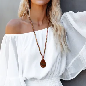 Bohemian teardrop red stone pendant necklace long sweater chain detail showcasing design