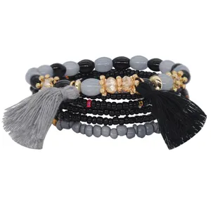 Pulsera multicapa de cuentas bohemias con borlas elegantes y cuerda elástica de playa.