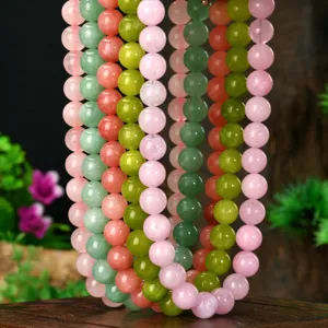 Natural stone beaded necklace detail, 10mm colorful gemstone beads hanging display shot.