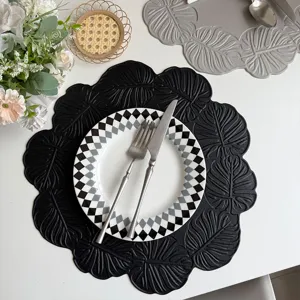 Zwarte monstera blad lederen placemat, waterdichte hittebestendige mat voor eettafel decoratie.