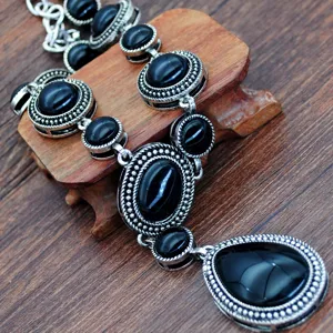 Vintage black stone sweater necklace with silver alloy teardrop pendant for women fashion.