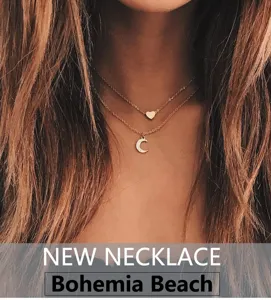 Gold layered necklace with heart and moon pendants, elegant clavicle chain for daily wear.