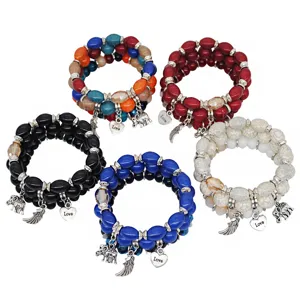 Conjunto de pulseras elásticas de cuentas multicapa bohemias con dijes de elefante y corazón.