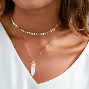 Gold layered necklace with white crystal pendant and disc chain for women fashion jewelry.