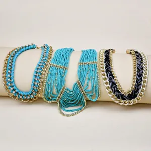 Fashion statement multi-strand turquoise seed bead and gold chain ribbon choker necklace set.