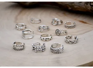 Vintage silver ring set featuring smiley face, stars, and geometric open designs for women.